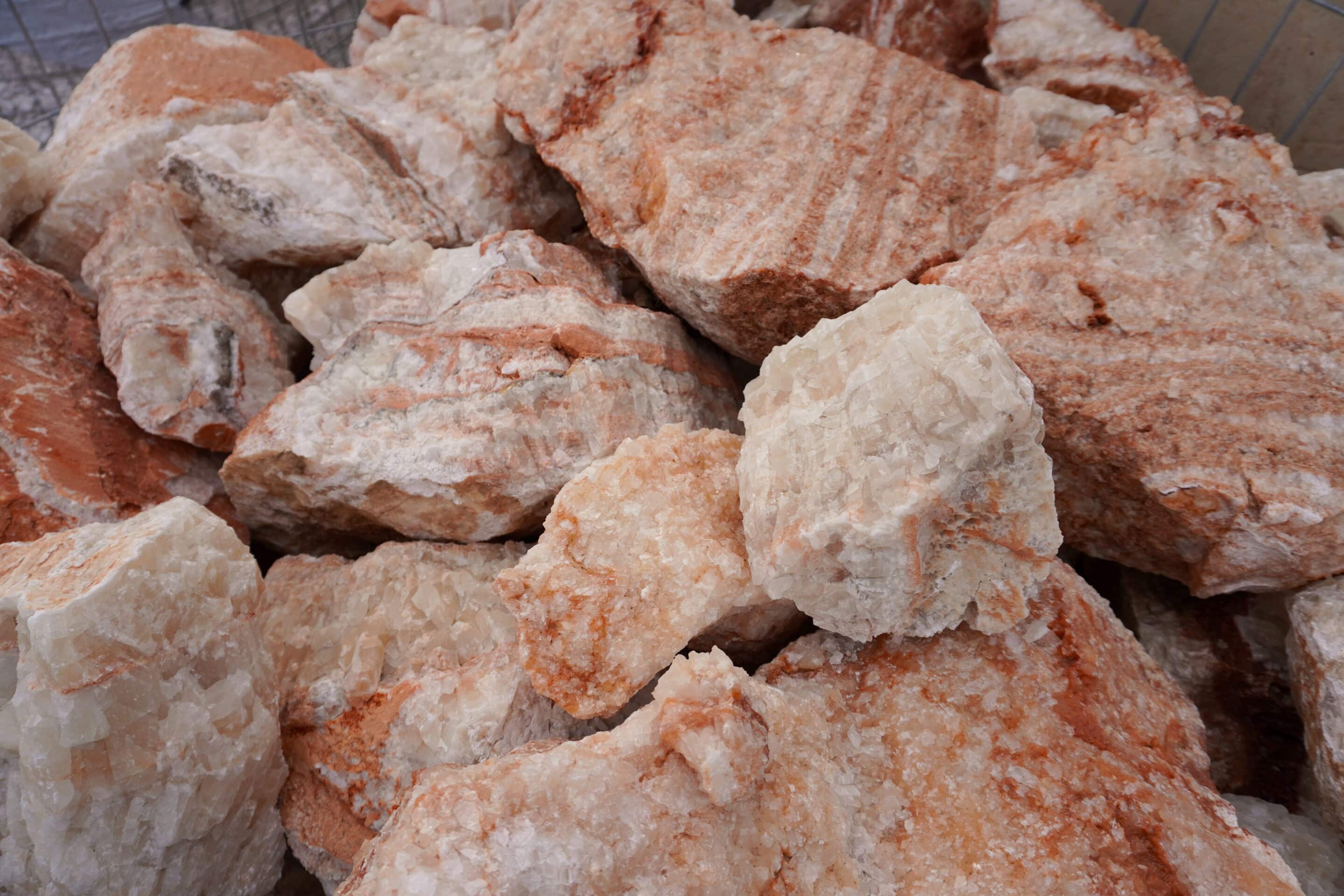 Landscape boulders compared at the yard for size and color in North Texas