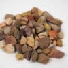 Large Apache stones in shades of brown, red, yellow, and beige, used for landscaping and decorative outdoor projects in Texas.
