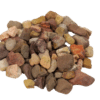 Large Apache stones in shades of brown, red, yellow, and beige, used for landscaping and decorative outdoor projects in Texas.