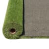 Emerald Green Turf 76 roll with vibrant synthetic grass and black woven backing, used for landscaping and sports applications in Texas.