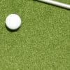Putting green turf with golf hole and flagstick, designed for golf courses and backyard greens in Texas.